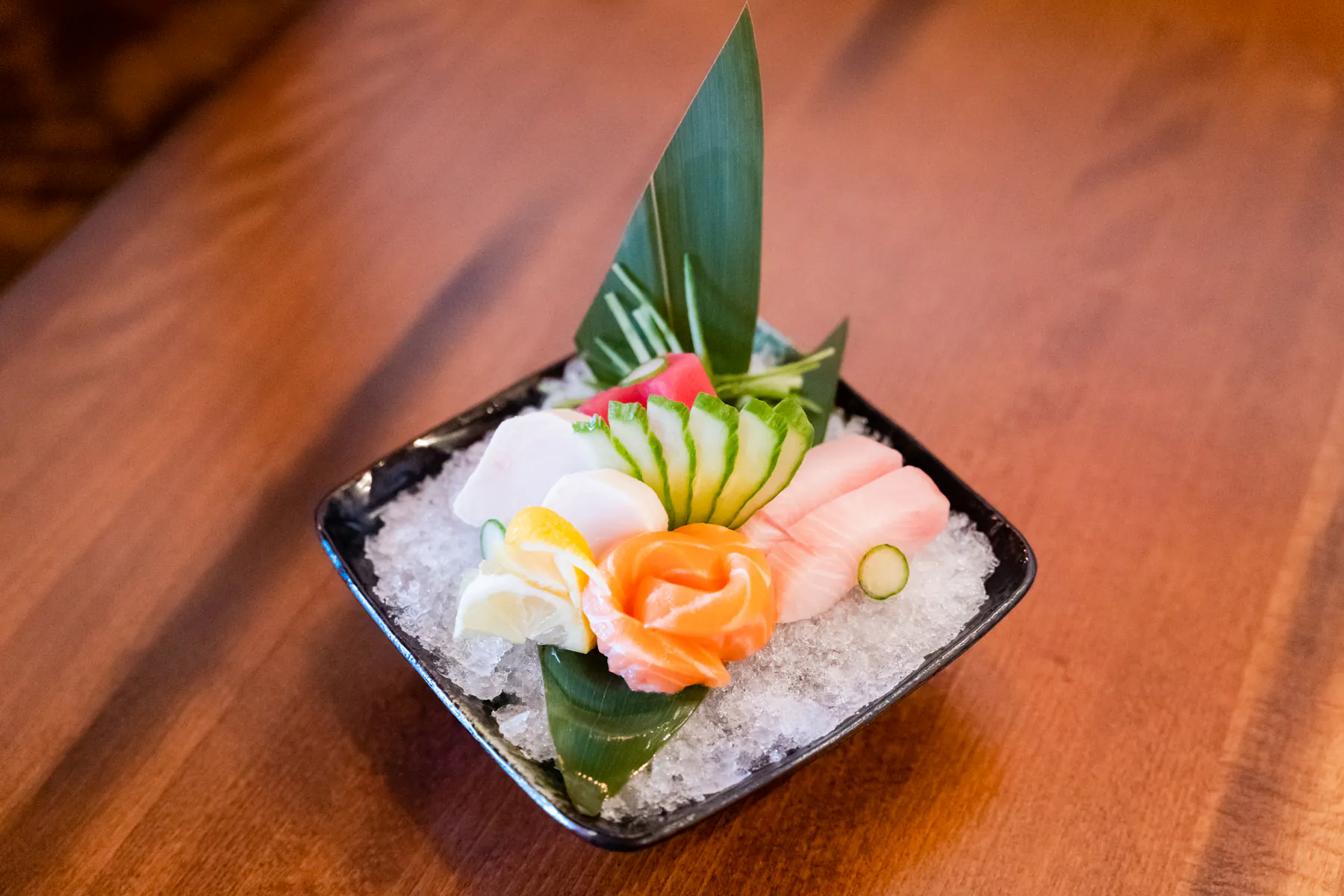 Fresh sashimi on ice with garnish at Aji Izakaya Cypress, a Japanese Restaurant in Cypress