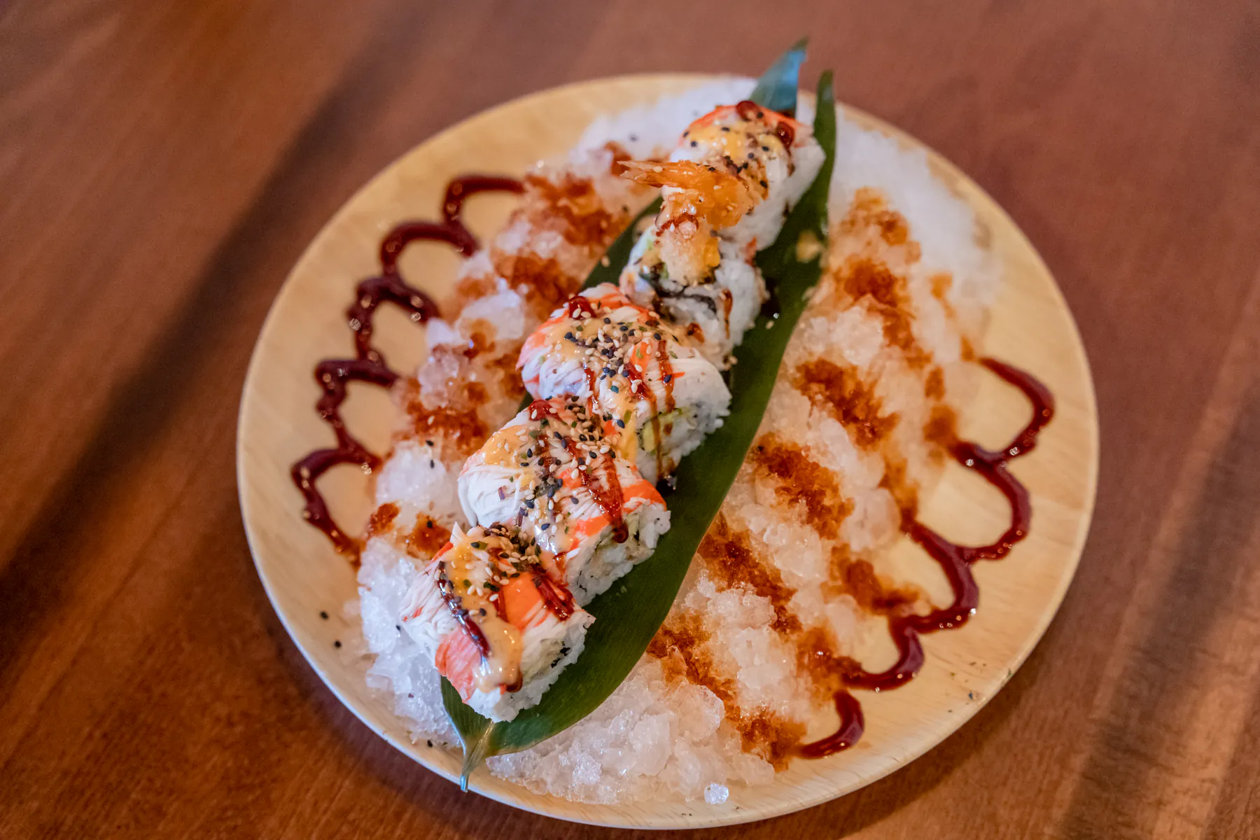 Chilled crab rolls on ice with sauces at Aji Izakaya Cypress, a Japanese Restaurant in Cypress